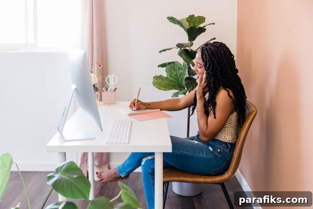 Woman working at desk. Looking for jobs where you work alone? If you're an introvert or simply want minimal human interaction, here are 40 work alone jobs.