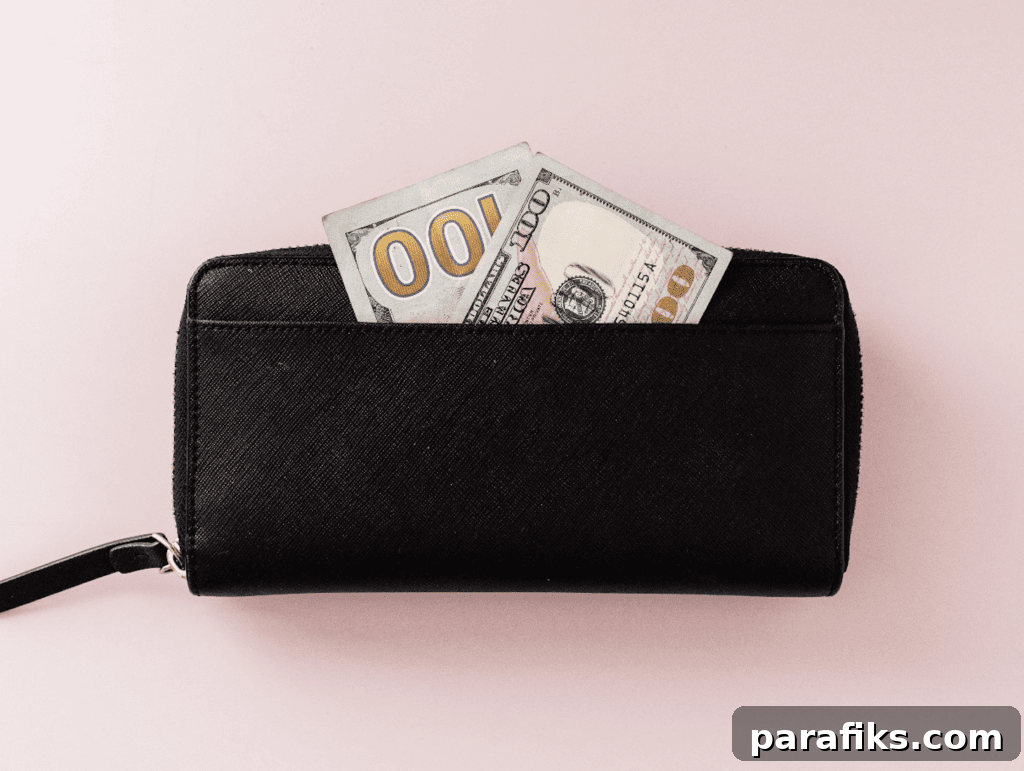 $100 bill in wallet. A No Spend Challenge Can Reset Your Finances – Here’s How To Do It