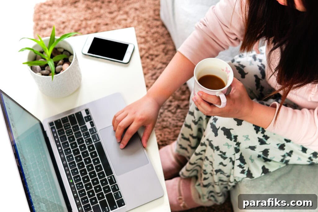person working from home on a laptop while wearing pajamas for the article best part time work from home jobs