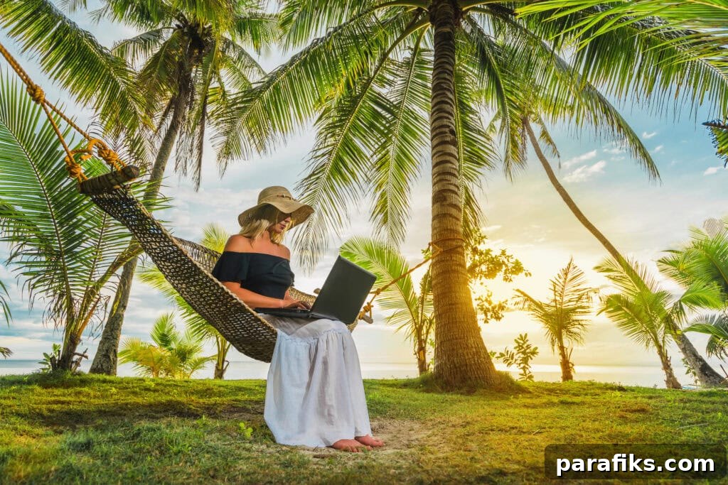 11 Low-Effort Strategies to Grow Your Wealth Fast 3 Woman in hat sitting in hammock on the beach with laptop.