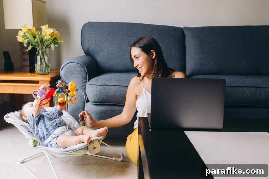 woman taking care of baby while working